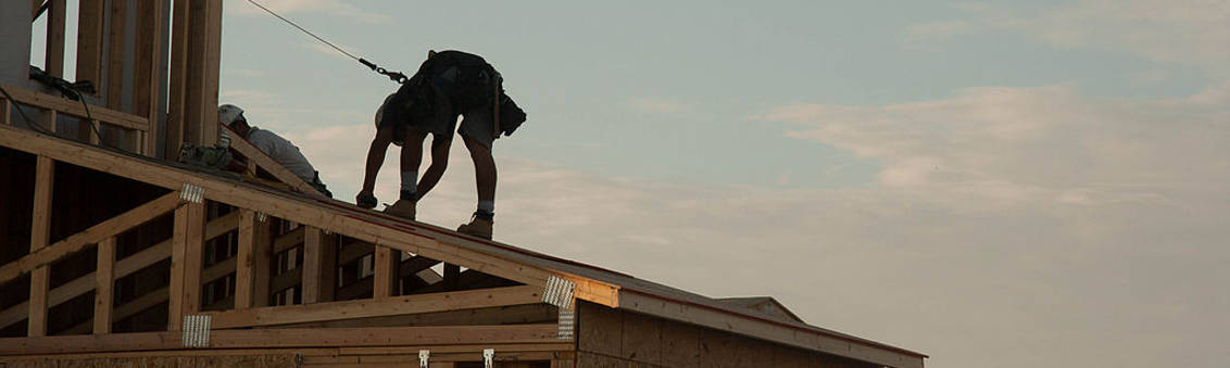 construction worker working on a building roof