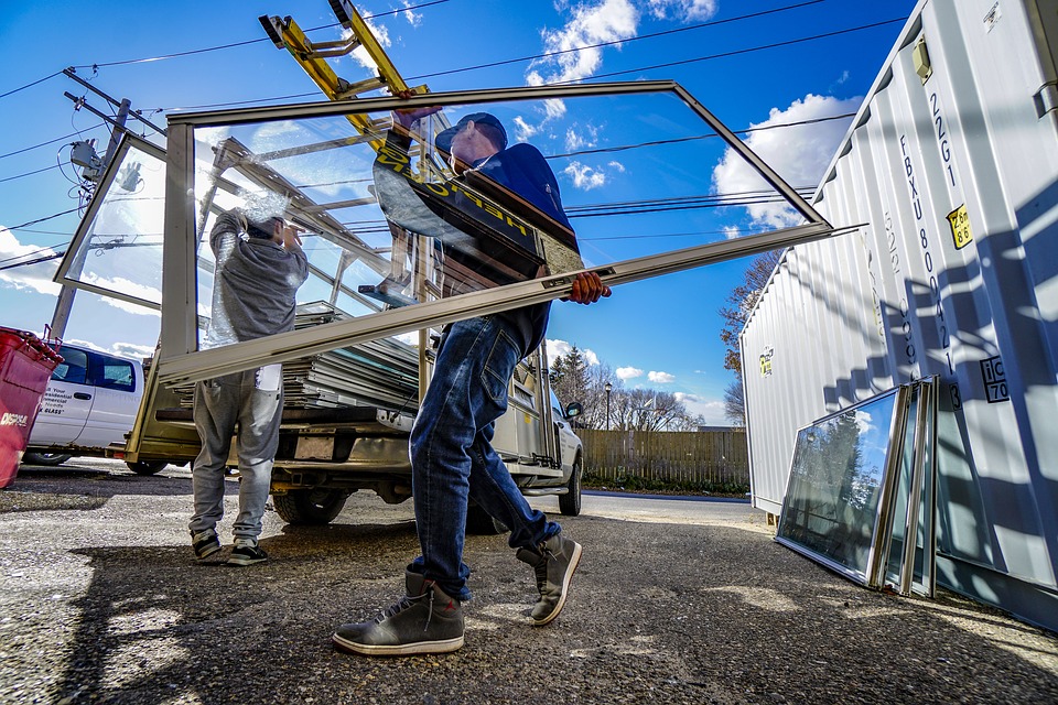 Contractor holding new windows