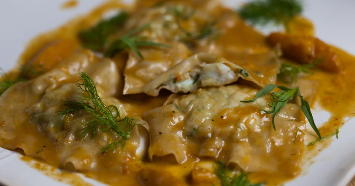 Raviole de langoustines à l’avocat, sauce orangée Glouton