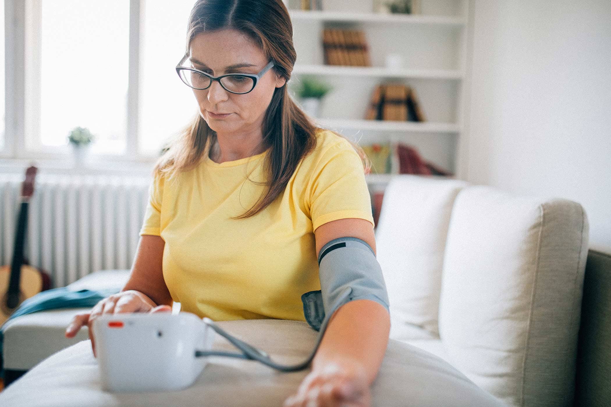 woman taking her blood pressure