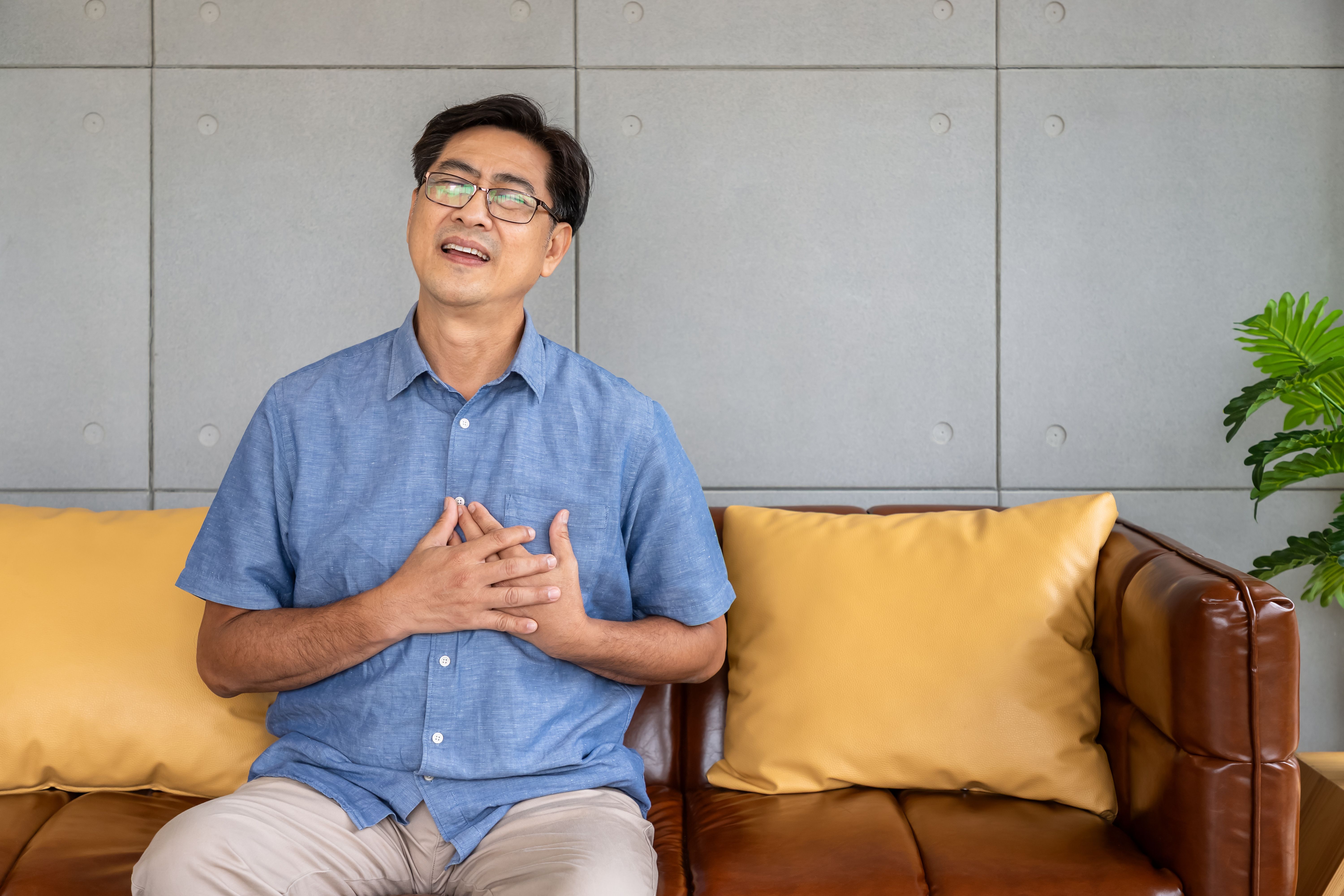 happy asian male with angina