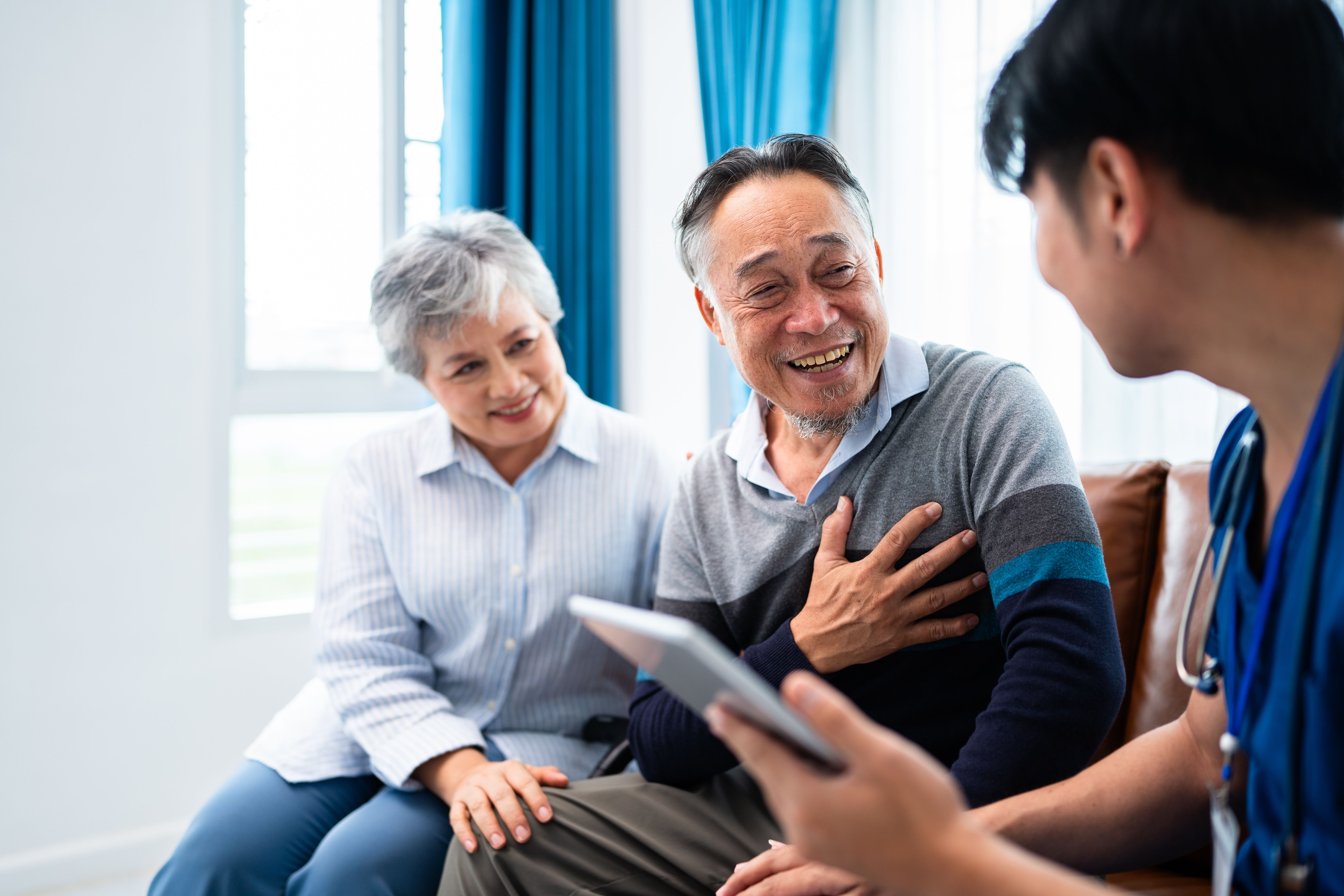 old asian couple cosulting with doctor