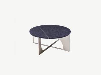 Round coffee table with sculptural metal legs and blue textured top.