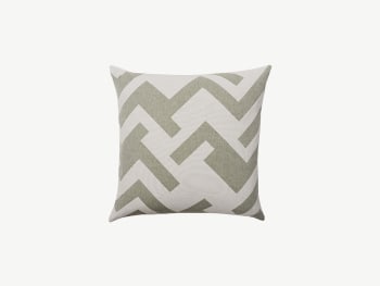 Cushion with sage green geometric pattern.