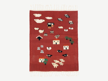 Red rug with playful subjects (animals, houses...9 added as a relief subject.