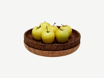 Cork bowls containing apples.