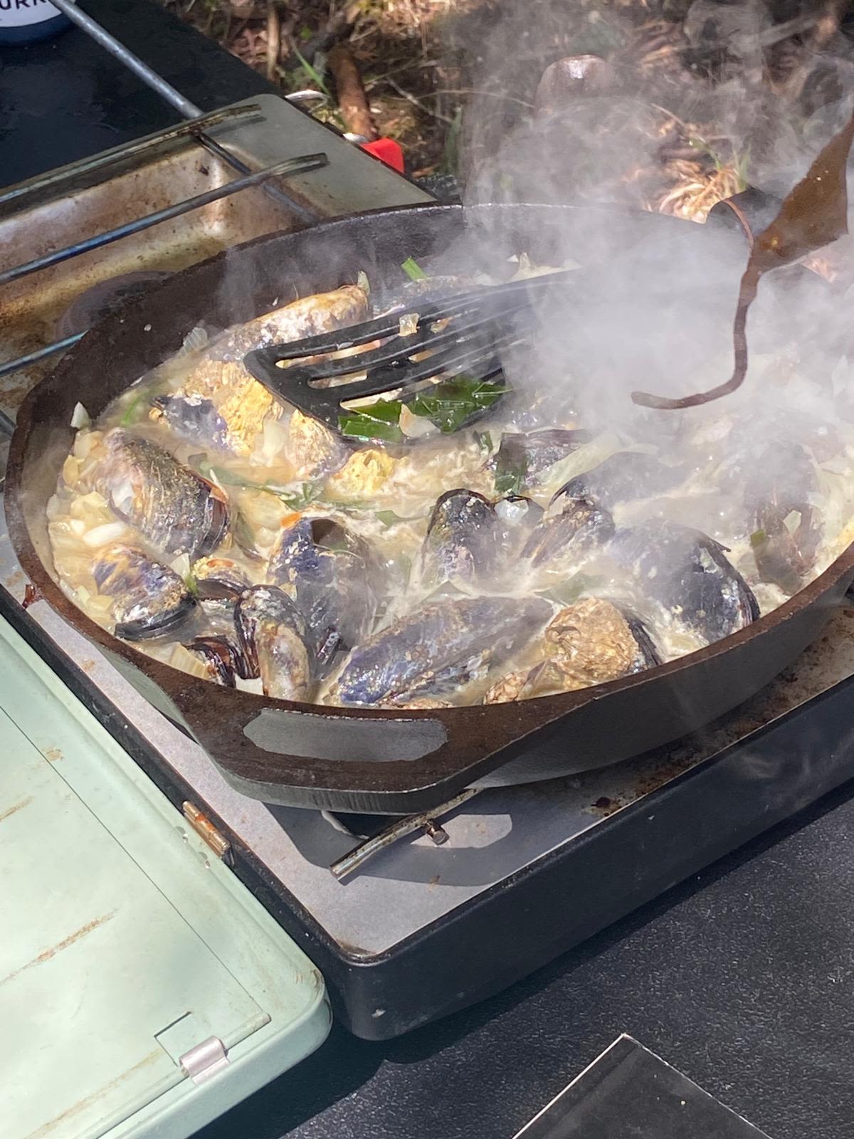 Traditional cooking with Coquille community members. 
- Photo by Shelley Estes