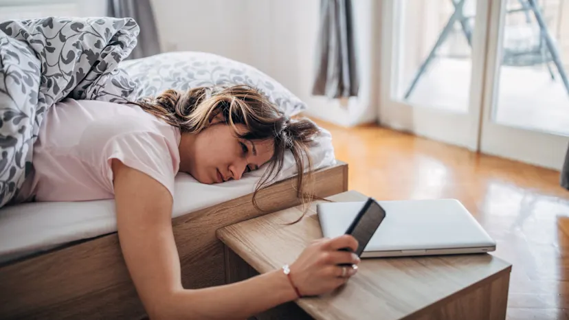 Woman lying in bed exhausted after a poor night of sleep