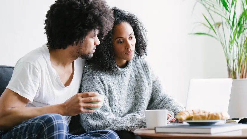 Man consoling his partner during breakfast.