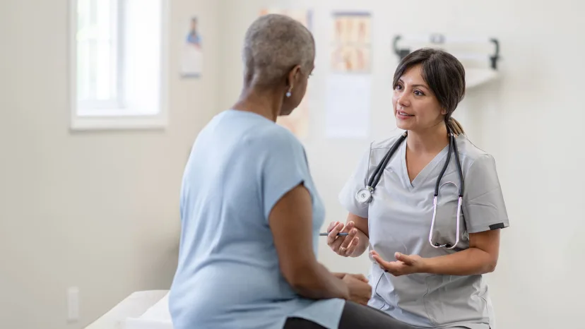 Mature woman with ovarian cancer talking to her healthcare provider