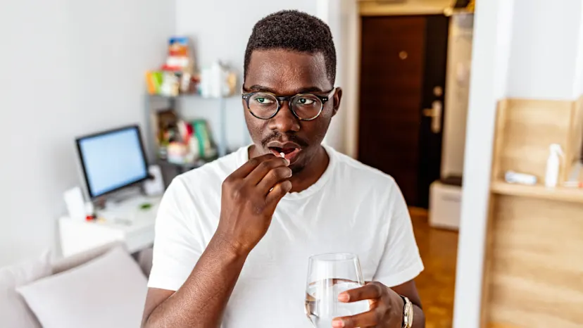 Man with HIV taking oral medication for treatment