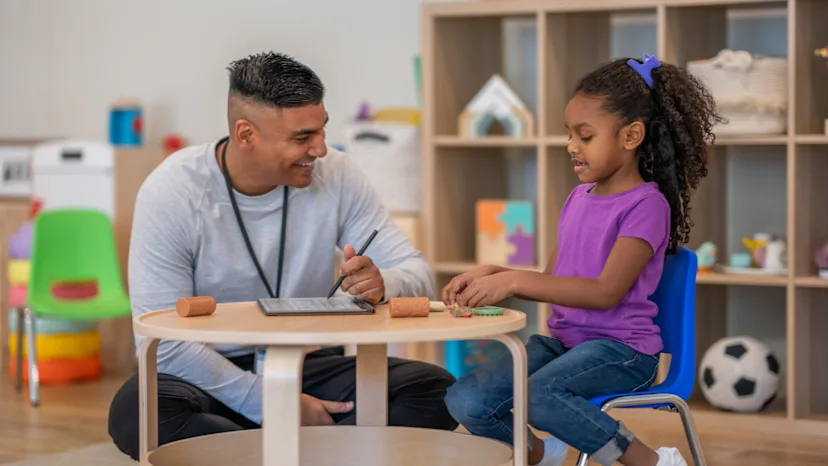 Young girl with ADHD in play therapy with a specialist