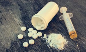 What does an opioid overdose do to the body?