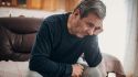 What causes psychosis symptoms in Parkinson's disease?