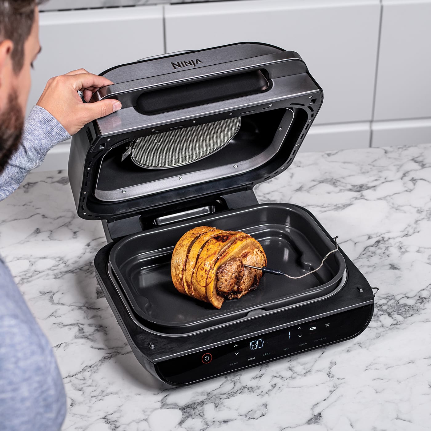 https://res.cloudinary.com/sharkninja/image/upload/f_auto,q_auto/v1599138012/Ninja/AG551UK/Ninja_Foodi_MAX_Health_Grill___Air_Fryer_AG551UK_RoastMeat_x3e35s.jpg