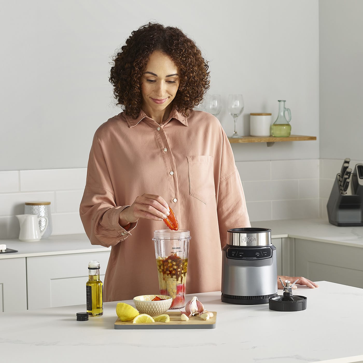 Ninja Blender With Auto IQ BN500UK Ninja Kitchen UK   Ninja BN500UK Houmous Model Adding Pepper 