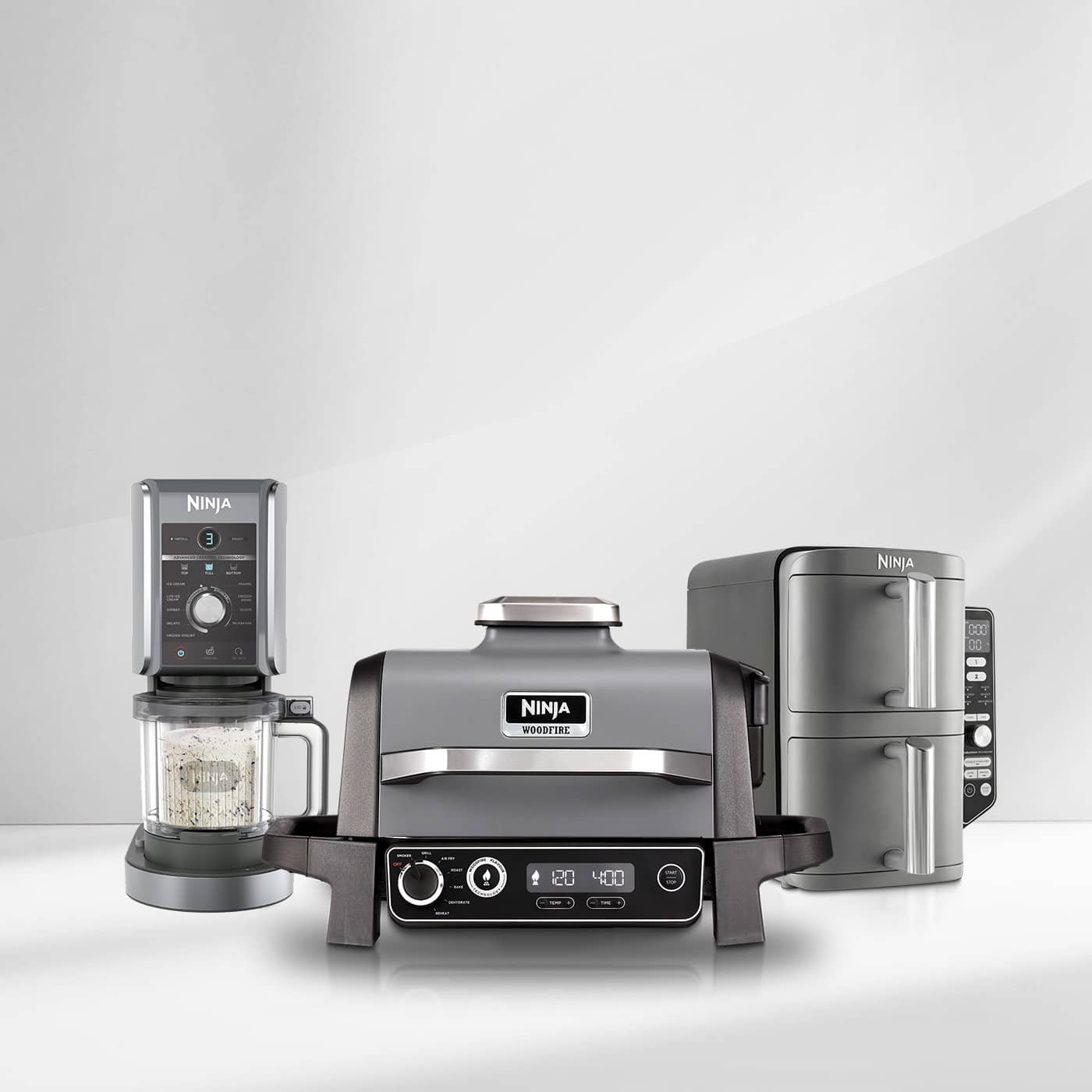Three Ninja kitchen appliances—including a coffee machine, grill, and oven—displayed on a light grey background.