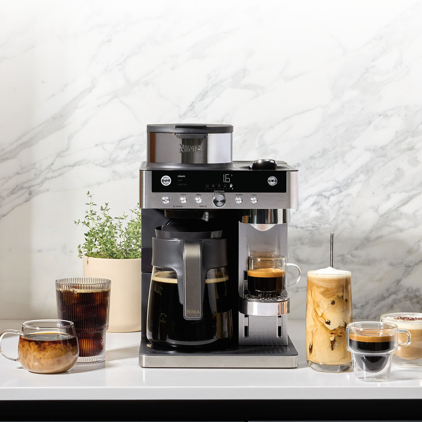 Ninja Luxe Café Pro Espresso Machine on a kitchen counter with coffee drinks.