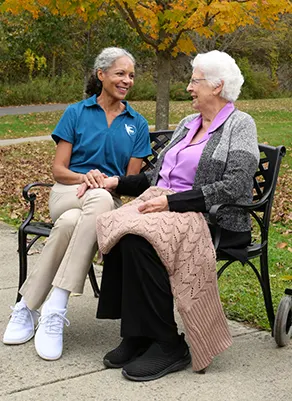 A diverse group of Visiting Angels caregiviers smiling and interacting with seniors, emphasizing the importance of personalized care options.