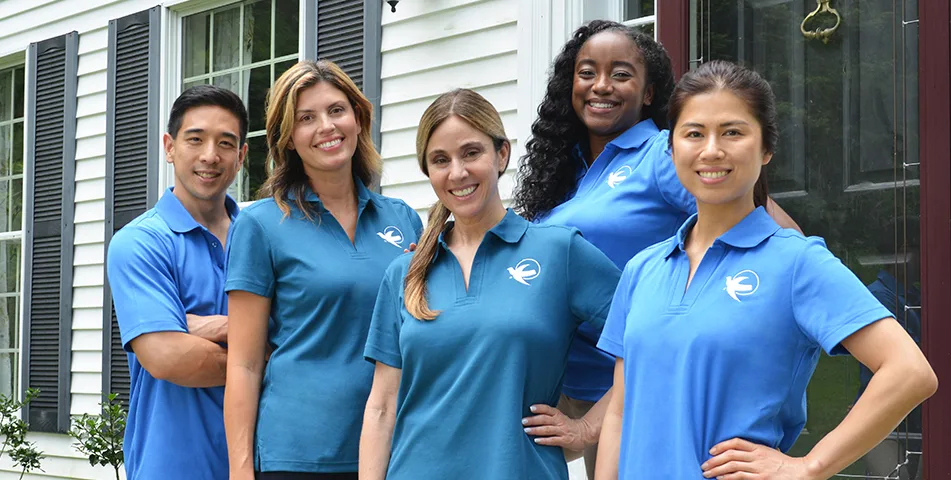 A Senior Home Care by Angels caregiver comforting an elderly woman with Alzheimer's, highlighting compassionate support in a peaceful home setting.