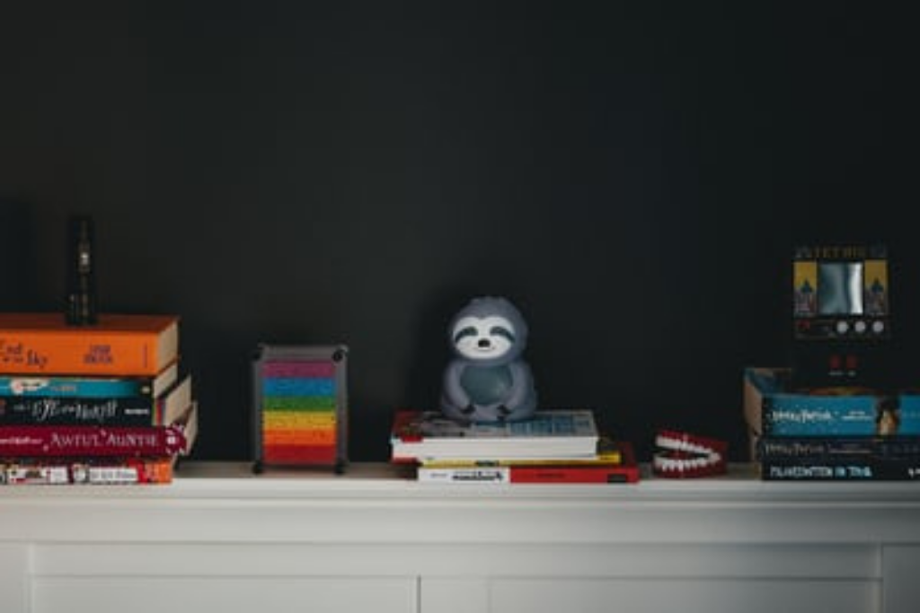 Books stacked on a mantle top