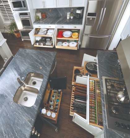 Overhead view of kitchen cabinets fully open