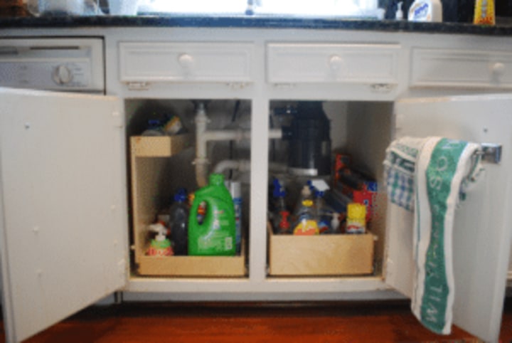 under the sink, under sink storage, kitchen storage