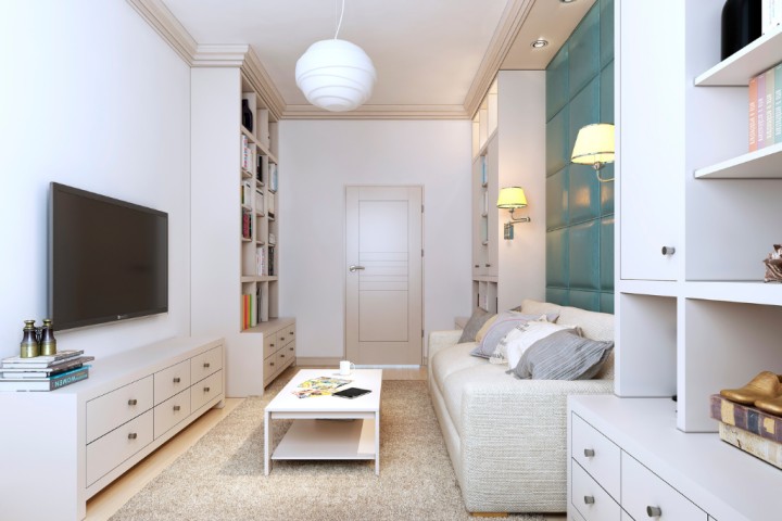 White living room with many drawers. 