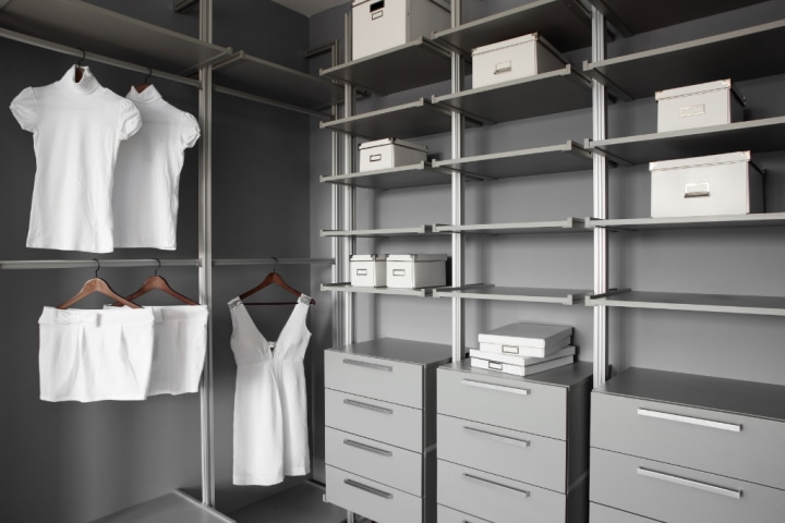 built in closet with white clothes