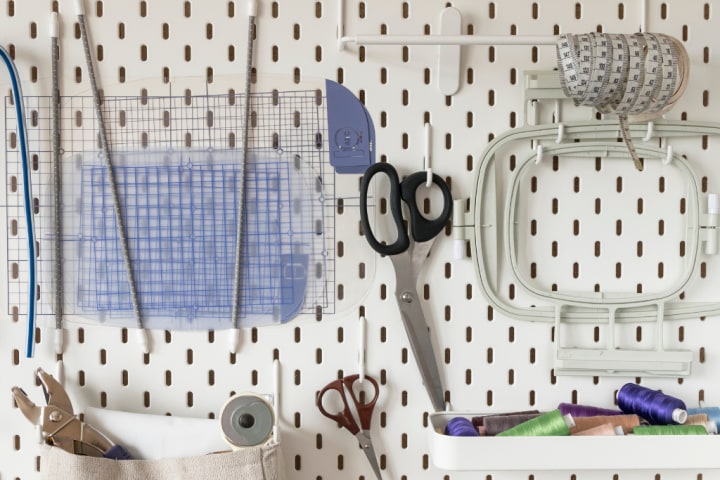 White pegboard with crafting materials