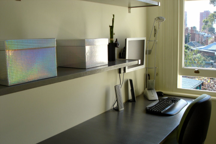 Closet home office with shelves.