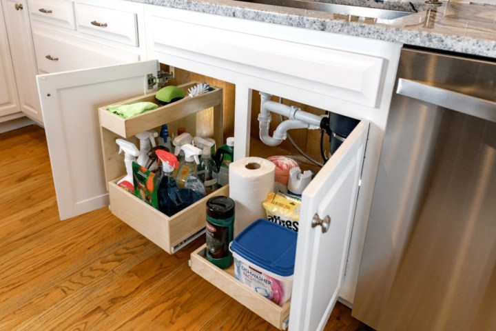 organized bathroom under the sink shelf