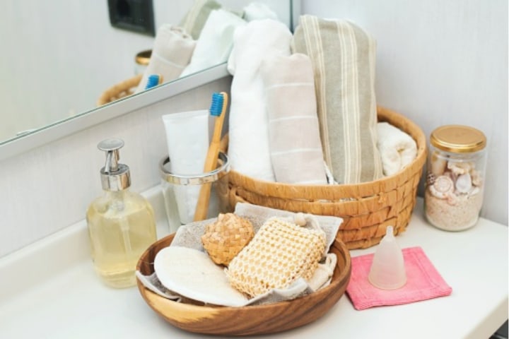 basket on toilet with toilet paper