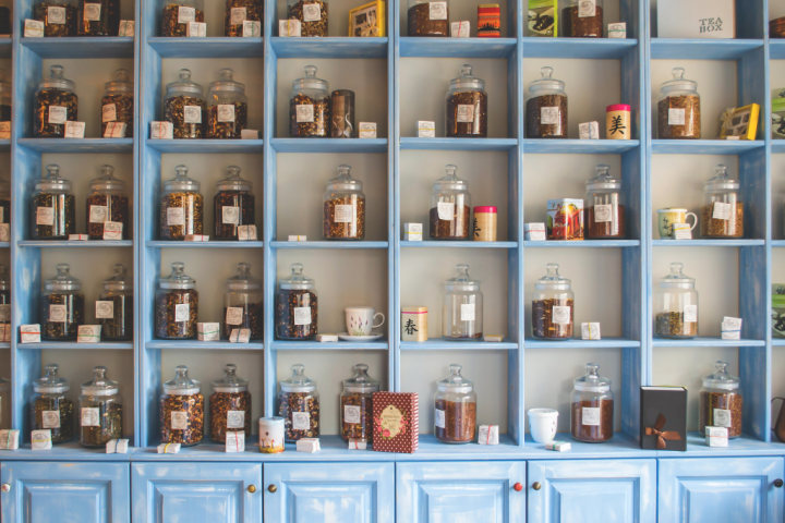 Blue pantry shelf with assorted jars