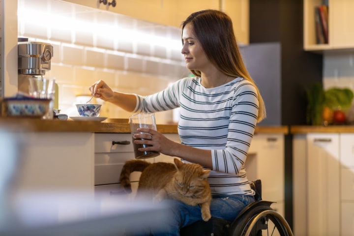 Woman in a wheelchair in the kitchen