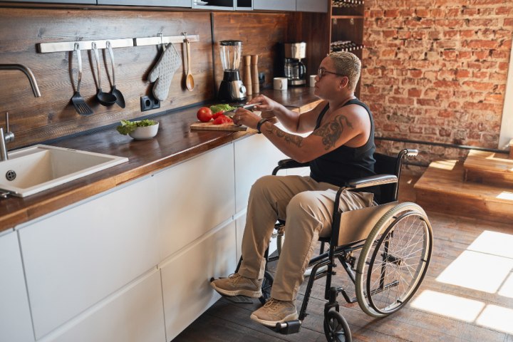 Disabled woman cooking