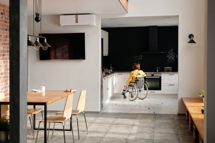 woman in a wheel-chair in the kitchen