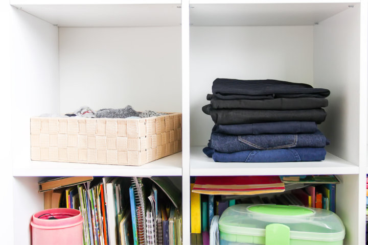 Built-in shelving holding miscellaneous items on the wall.