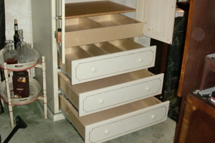 Cabinet or armoire repurposing can be perfect for attractive wine storage.