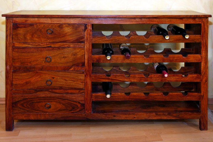 Repurposing old furniture is a wonderful way to display your wine bottles. 