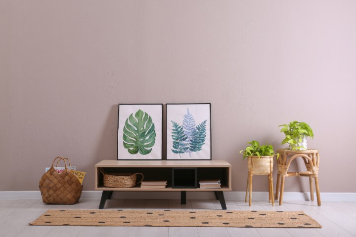 Baskets and bins are great for organizing items stored under the TV.