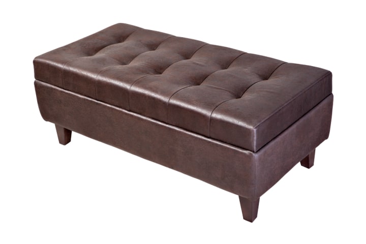 A dark-brown ottoman with a storage compartment