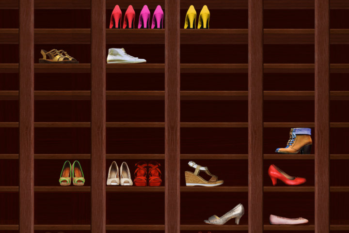 A vertical shoe rack with shoes