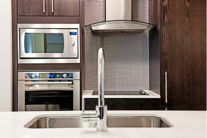 kitchen with microwave and oven