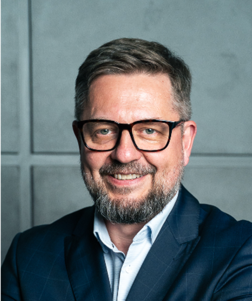 Paweł Rynkiewicz headshot.