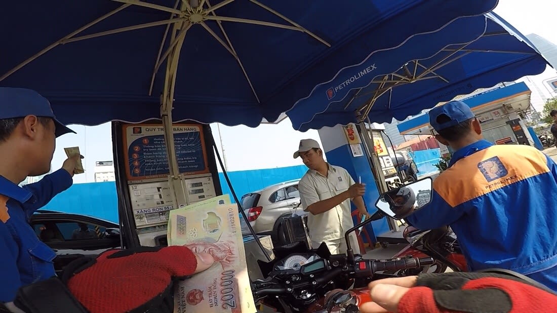 Me paying 240000 VND at PetroLimex in Saigon 