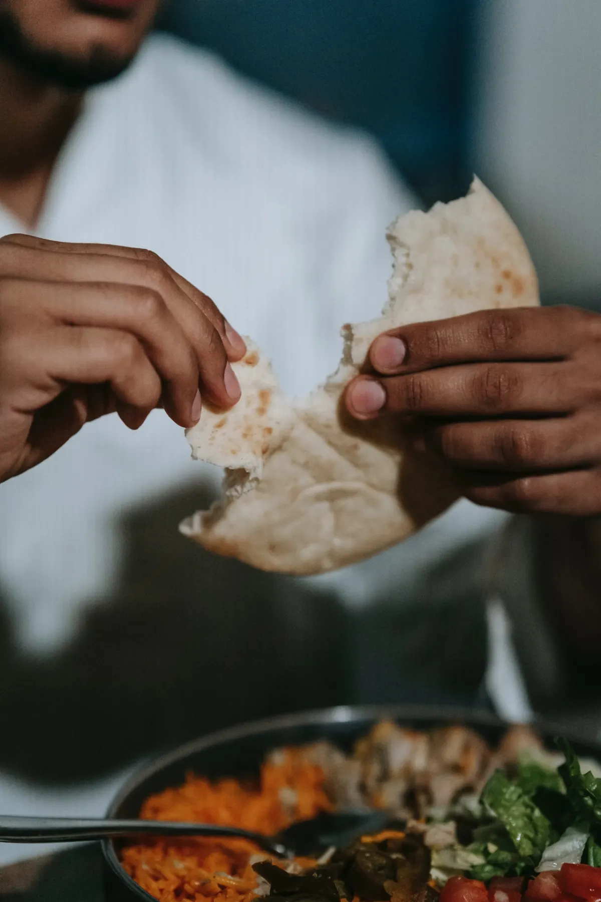 A Muslim eating halal food.