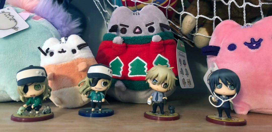 Four sweet pool figurines, two Zenya, one Tetsuo, one Youji, all in chibi style.