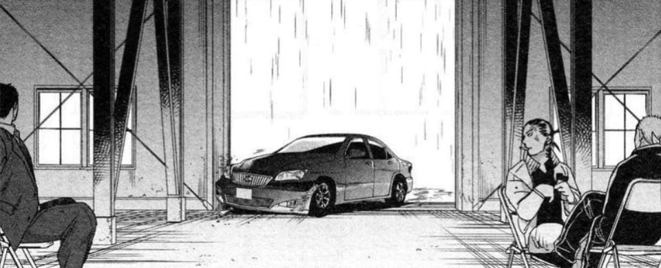 Yashiro crashes the Lexus into a building.