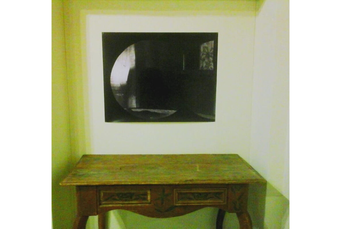 Ersatz (2014), installation view: assemblage of Ethnographic Museum artefact, large format print (manipulated family photo).
